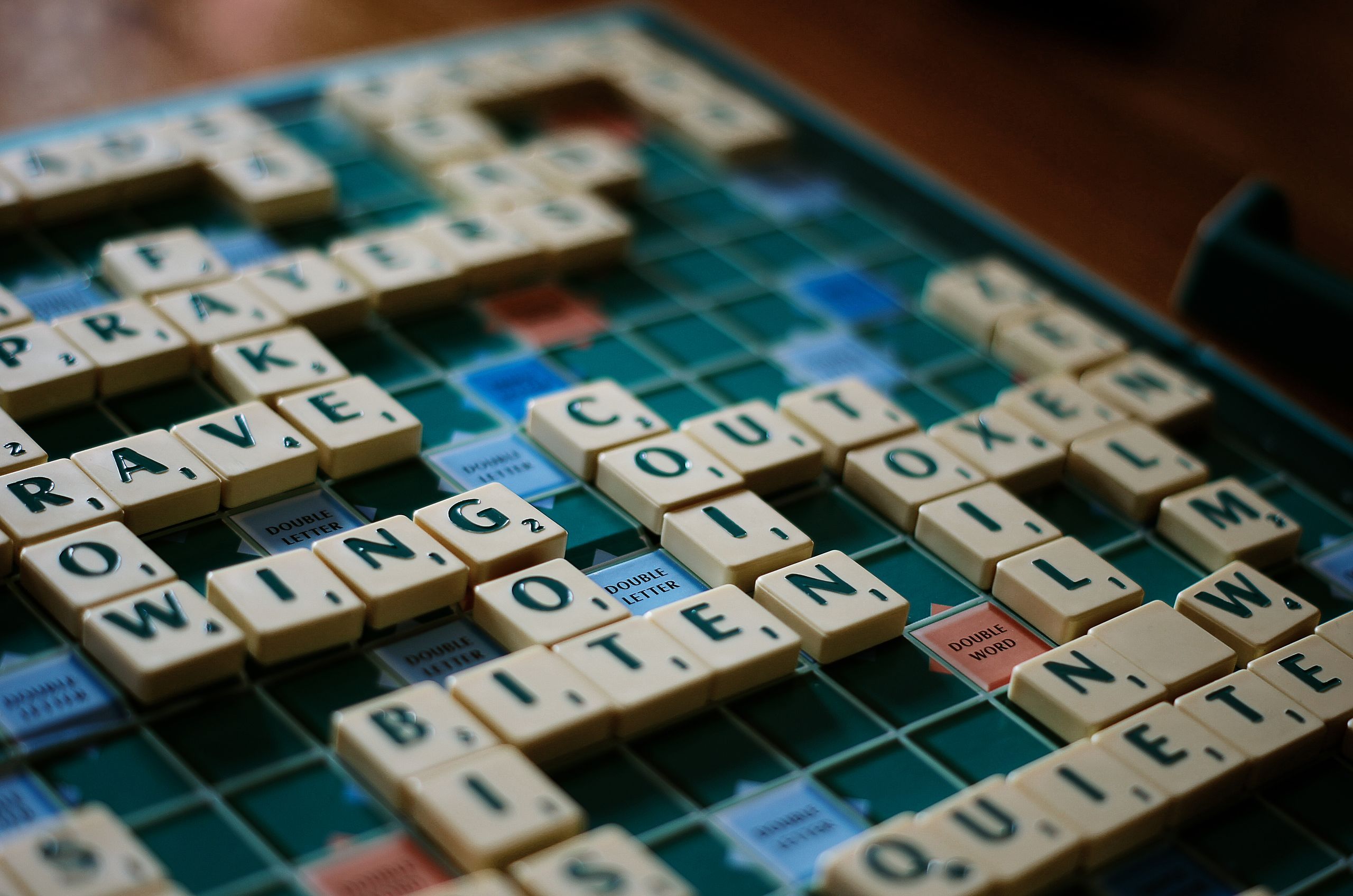 Scrabble board game with letter tiles